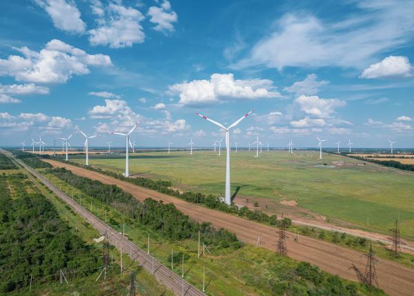 Electric sector modeling image--aerial view of wind turbines and power lines